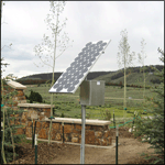 The solar panel behind the sign
